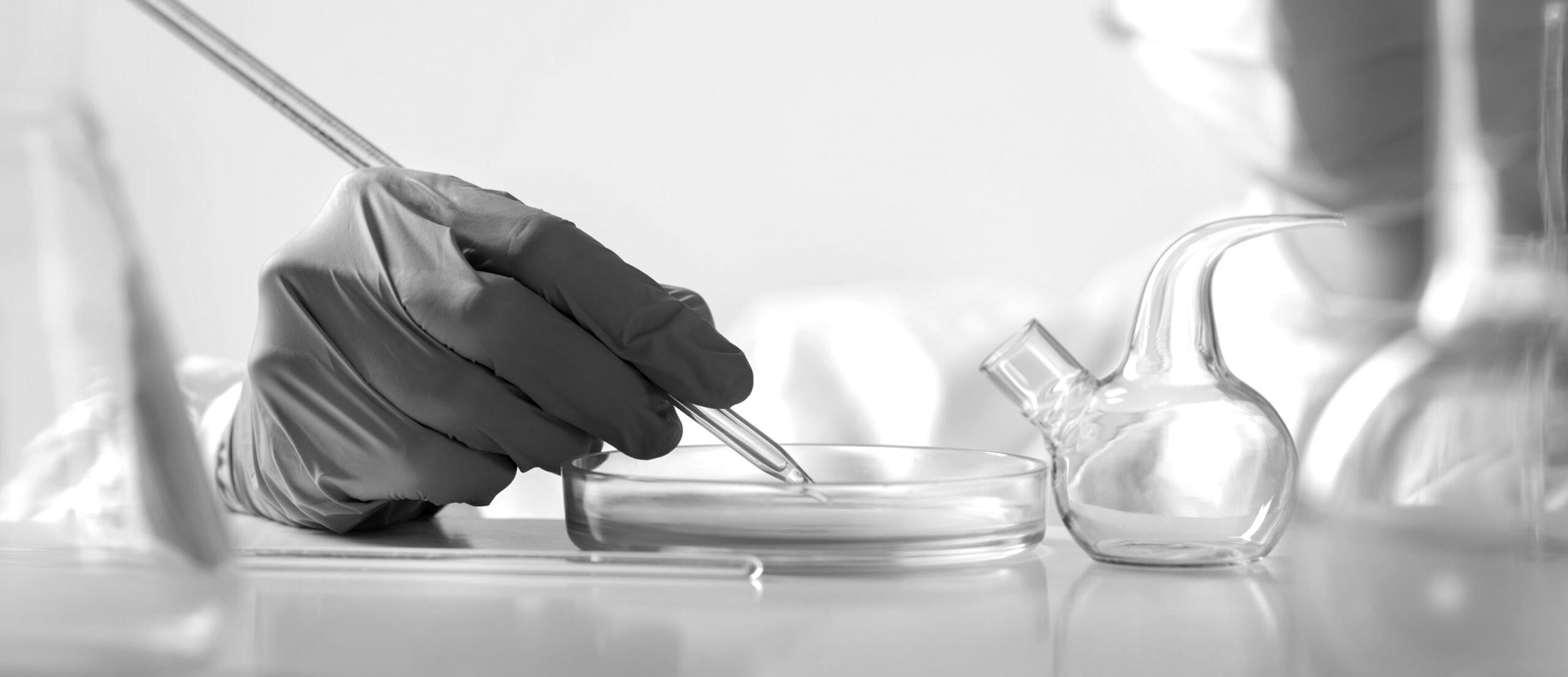 A NexGen laboratory technician transferring a sample by pipette